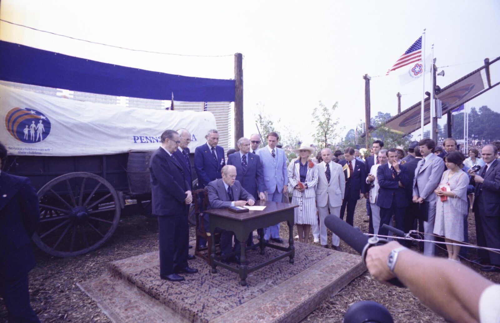 President Ford at a Bicentennial signing ceremony in Pennsylvania. Standing with him are Pennsylvania's senators, Hugh Scott and Schweiker, along with Interior Secretary Thomas Kleppe, Gov. Milton Shapp, Rep. Richard Schulze and Susan Ford. Three weeks later Schweiker joined Reagan's challenge to Ford for the nomination.