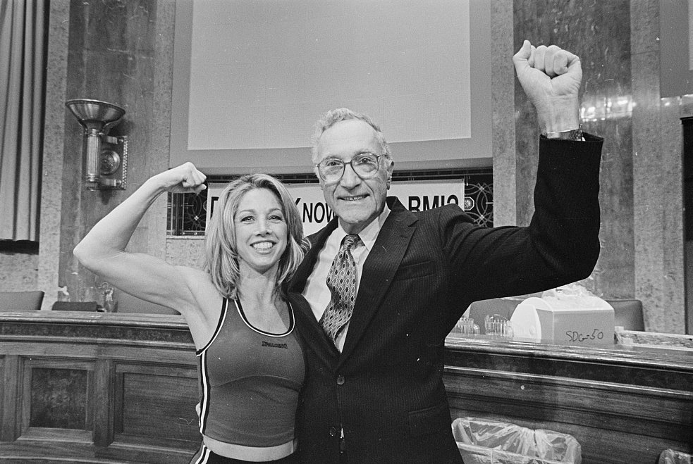 Flexing with fitness instructor Denise Austin at a Shape-Up America event in the Dirksen Senate Office Building.